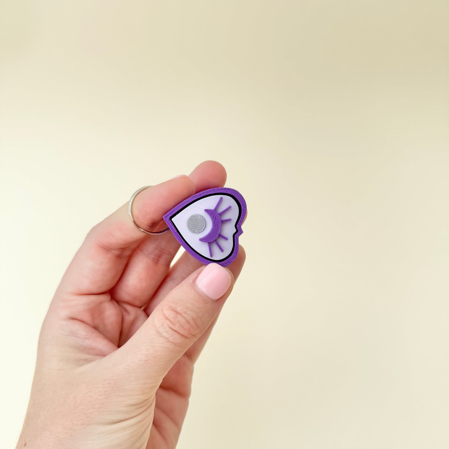 planchette style fidget with raised details for tactile stimming