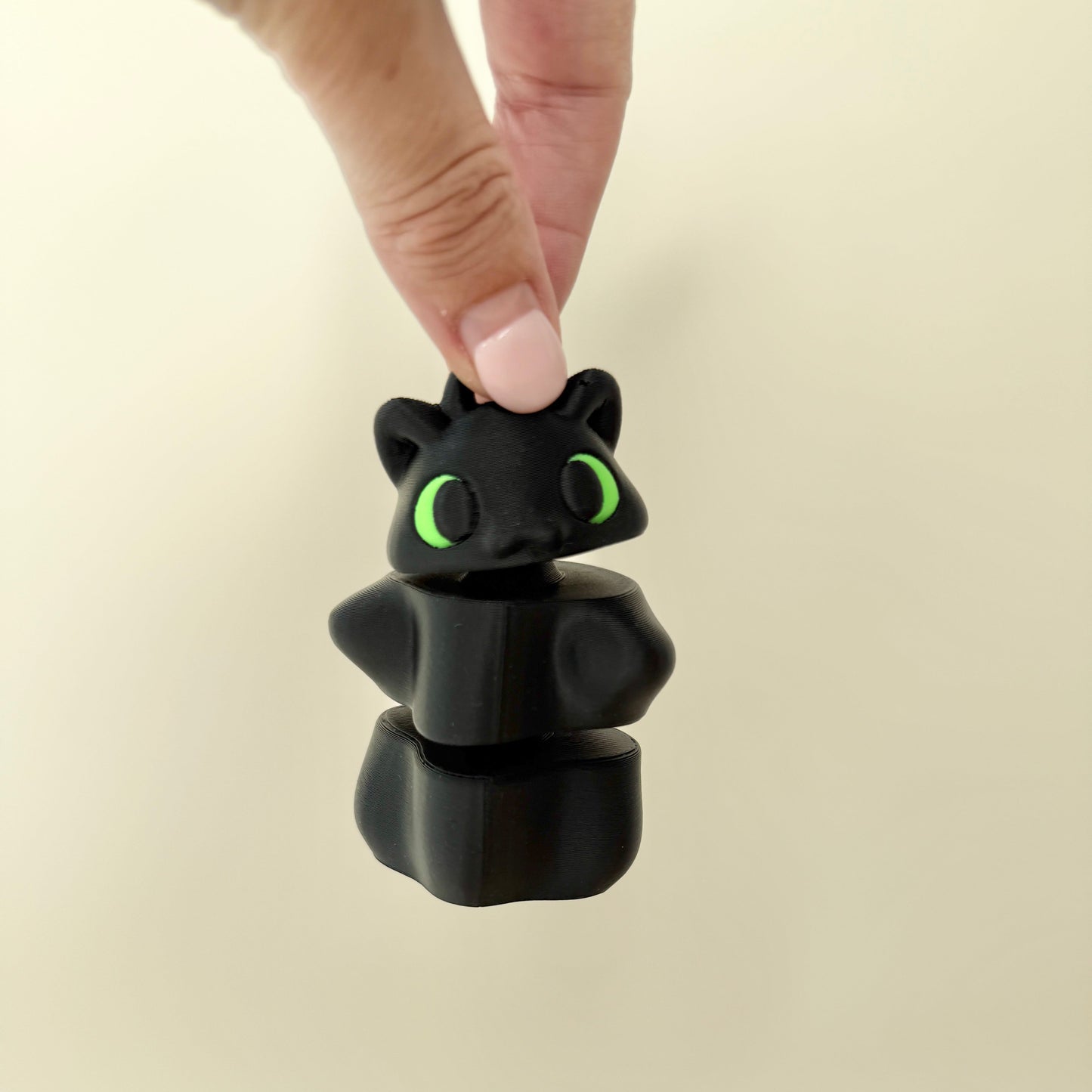 stacked handheld spinner with tactile ridges for grounding, repeatable motion, and regulation