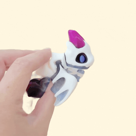 Jointed dragon figure for sensory play and stress relief; compact, display-ready, and made for satisfying, silent fidgeting.