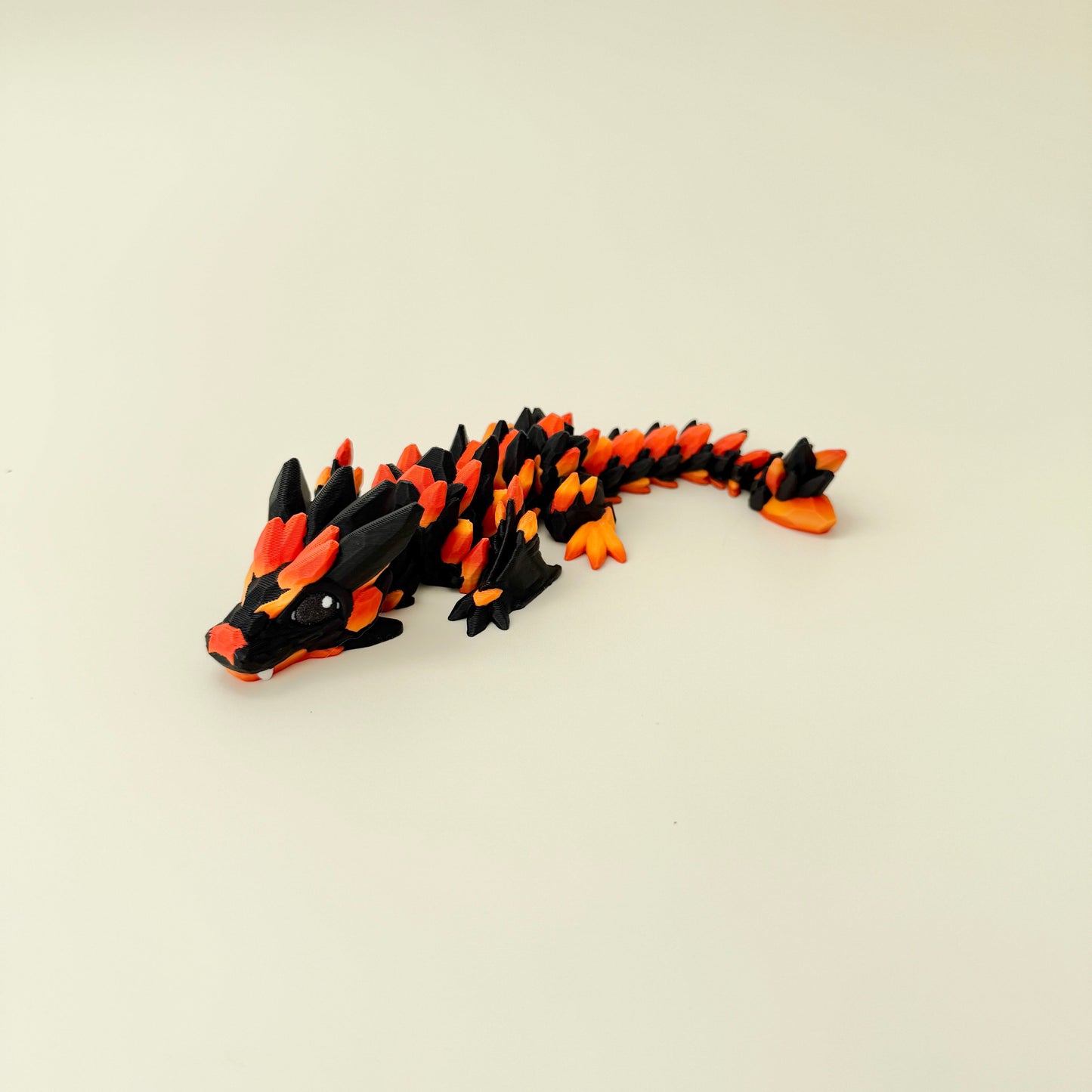 dragon fidget toy with crystal-style spikes and colour-changing gradient