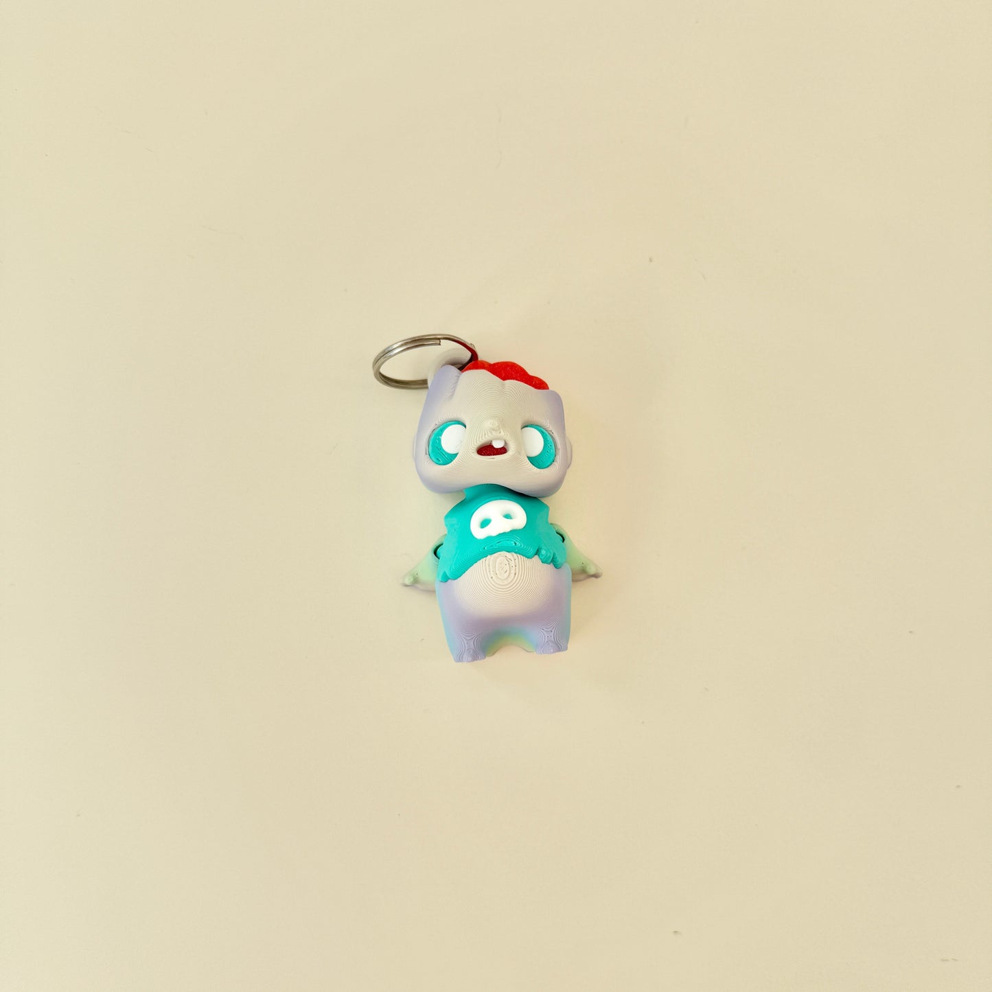 Small spooky-cute fidget figure with moving head and arms for quiet stimming.