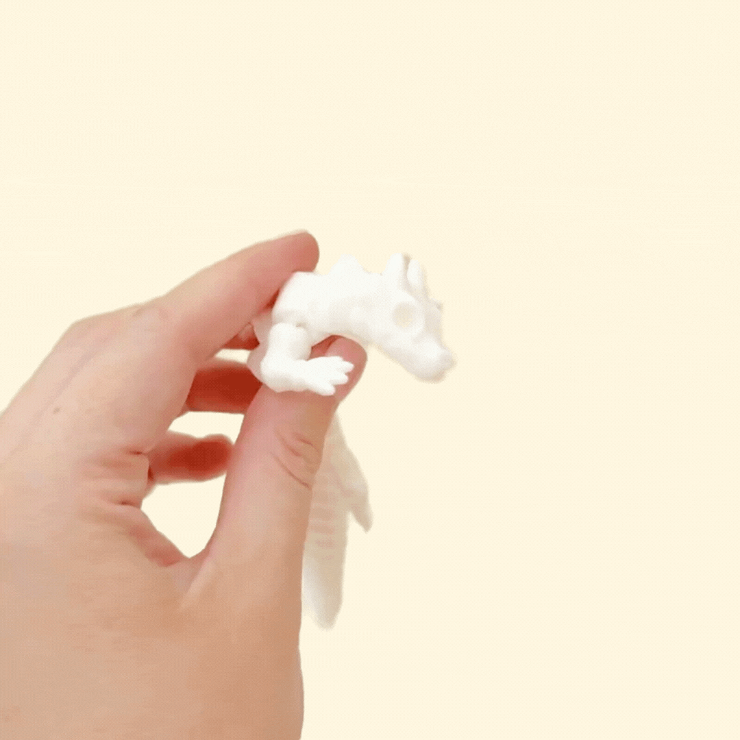 dragon-shaped articulated fidget with smooth white finish