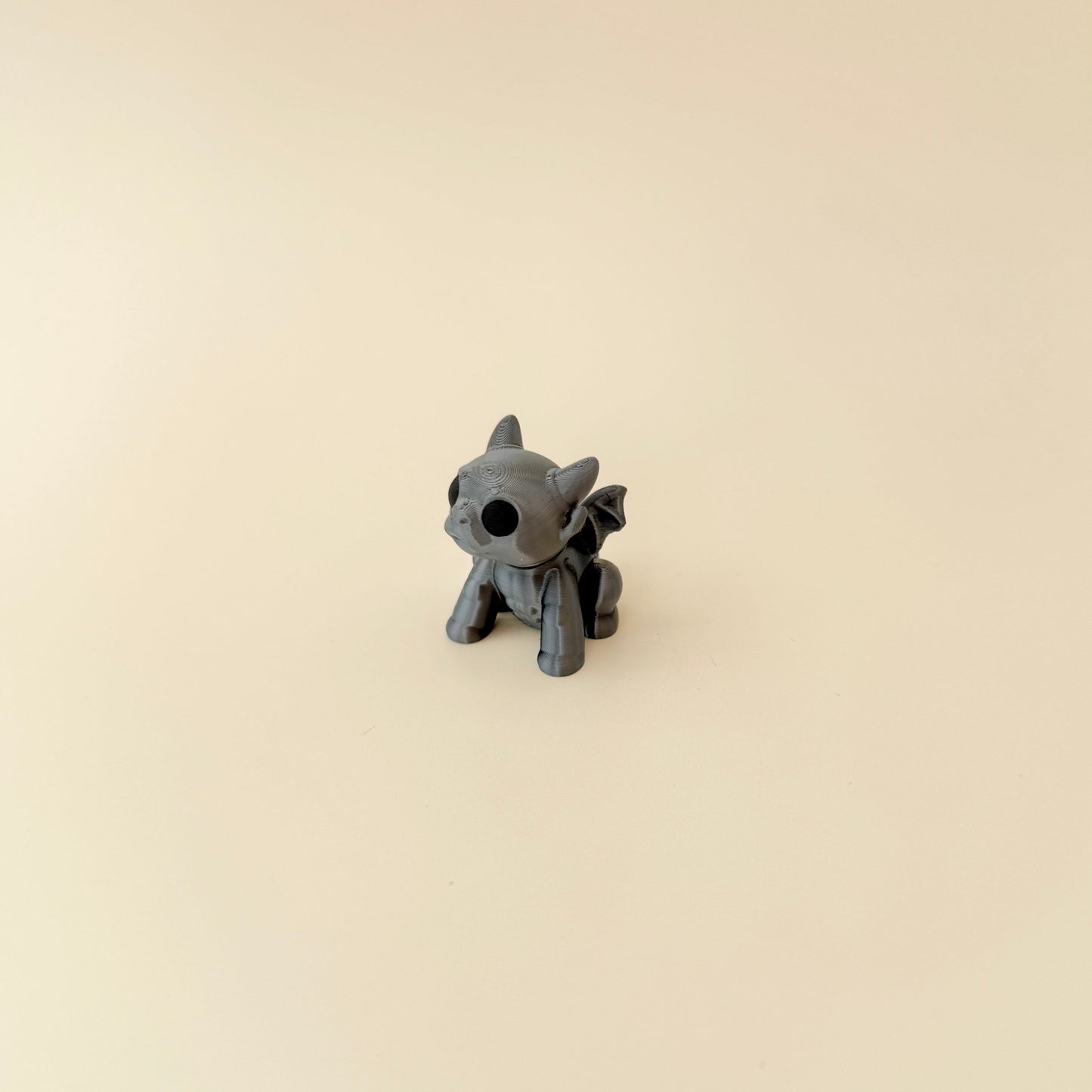 mini gargoyle figurine with horns and tactile details for grounding