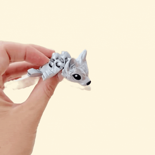 fantasy wolf fidget with white wings and metallic body for tactile regulation