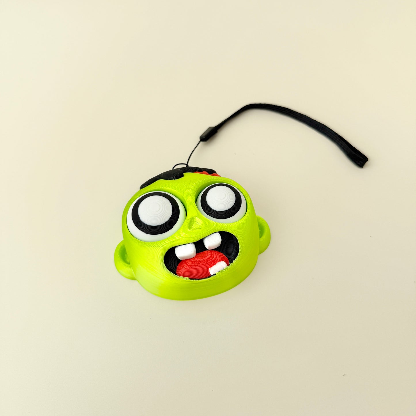 handheld clicker fidget with carry loop for bags, lanyards and travel