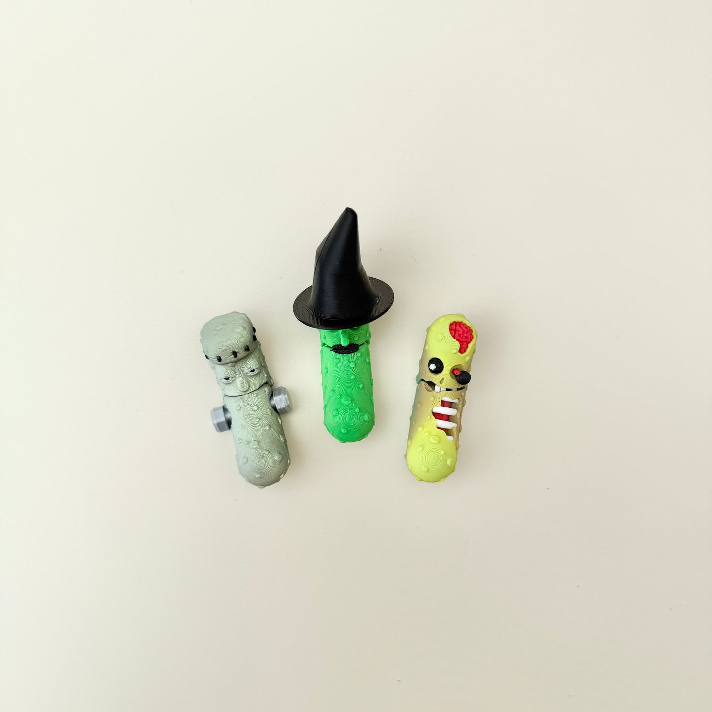Halloween pickle fidget toy with exposed brain and teeth, tactile bumps, mouth opens when wiggled, keyring-ready
