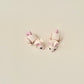 Fully articulated beige mouse fidget toy with pink details, 6.5cm long, designed for stress relief and sensory play.