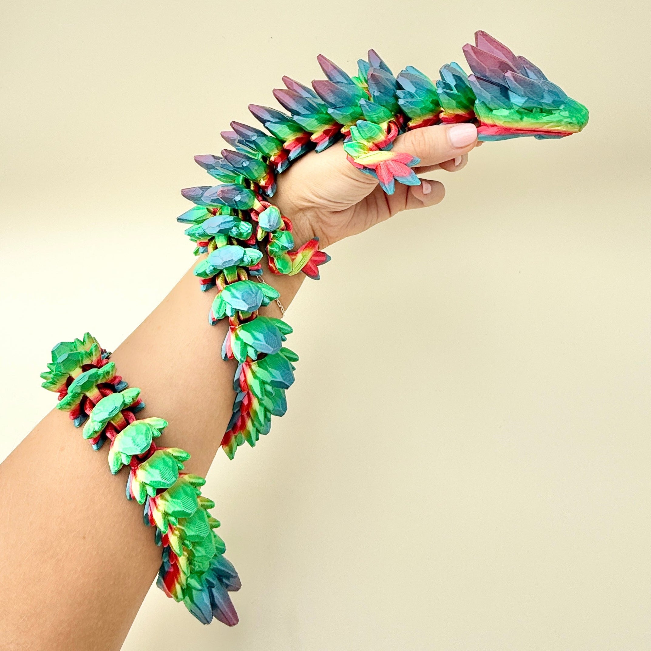 Extra-large flexible dragon fidget toy with a bold rainbow colour gradient