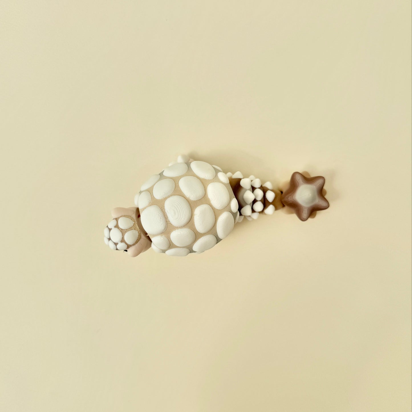 chunky articulated fidget with bumpy details for tactile input and focus
