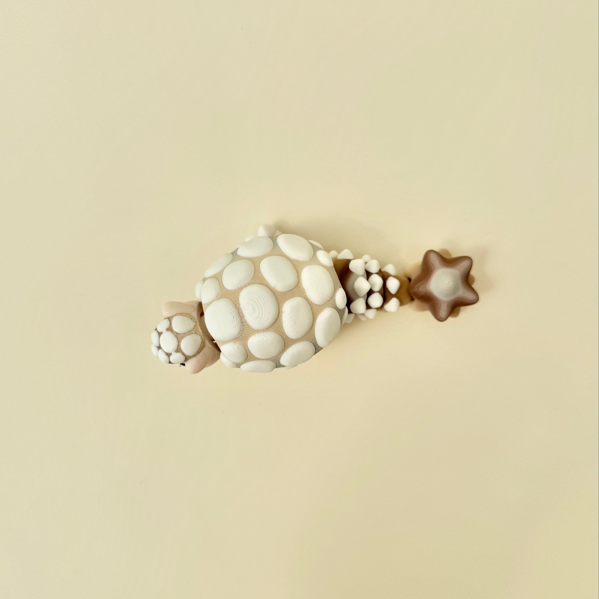chunky articulated fidget with bumpy details for tactile input and focus
