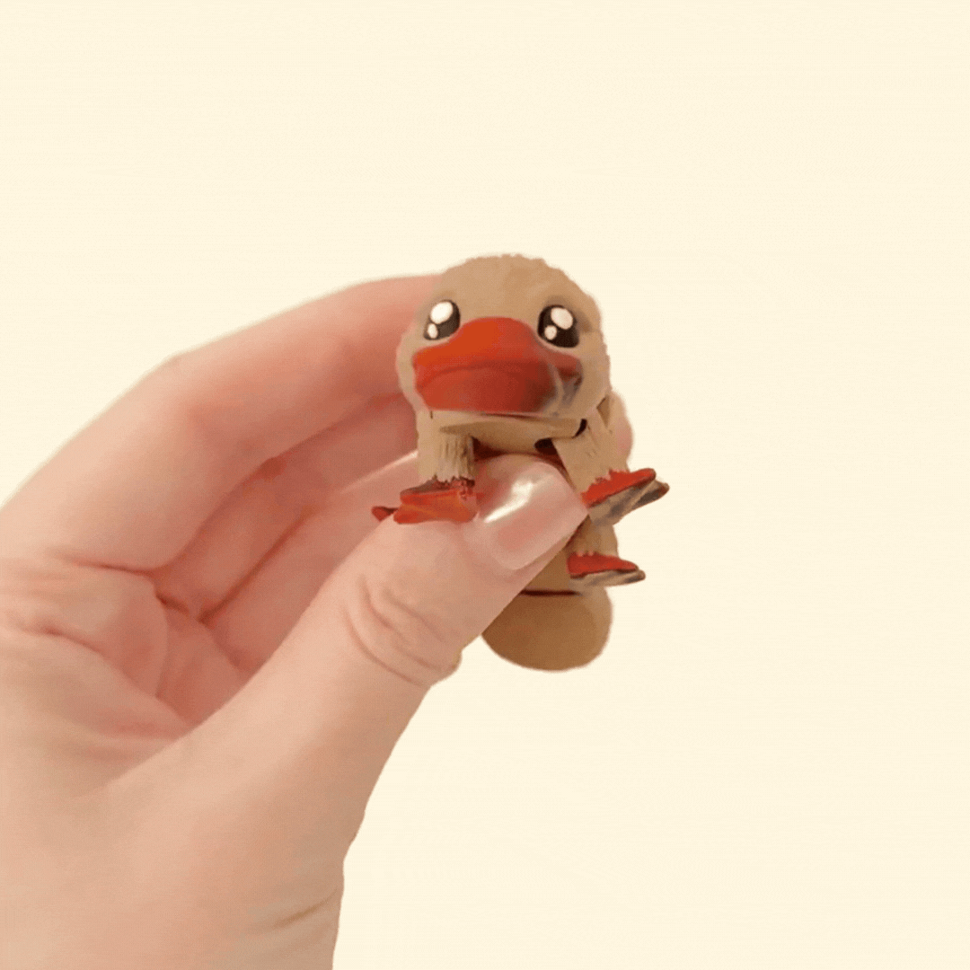 Brown realistic platypus fidget toy with a two-tone orangey-brown beak and feet, fully articulated for sensory play.