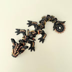 Large flexible dragon fidget toy with textured gear-style details and raised surfaces for tactile sensory play