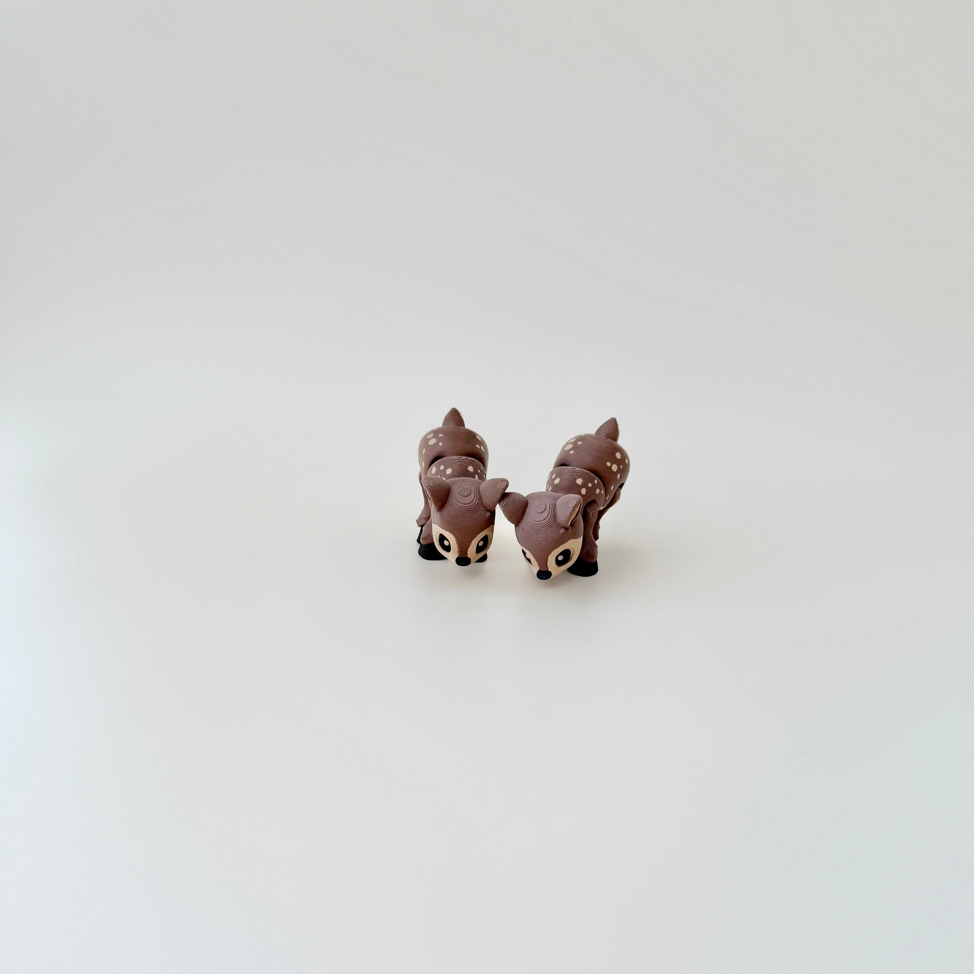 Articulated deer fidget toy with moveable legs, head, and body, ideal for sensory play.