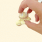 Compact 5 cm turtle with gentle wiggle motion for quiet fidgeting.
