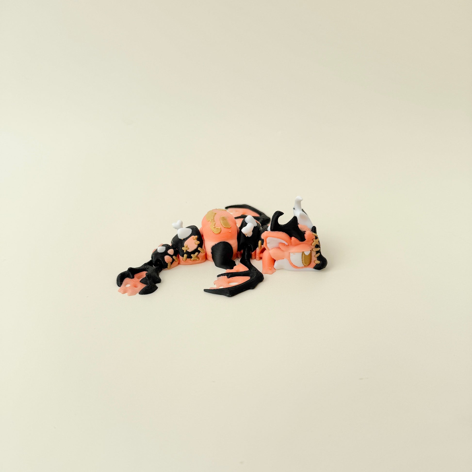Segments move smoothly so the dragon can be posed for quiet, tactile fidgeting.
