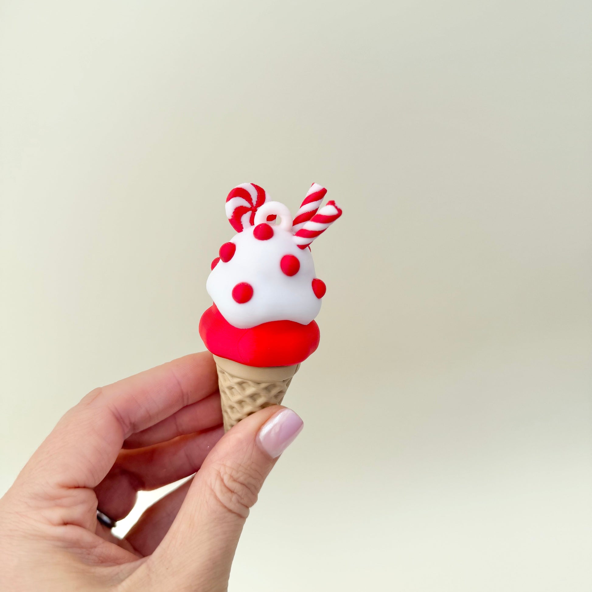 Cone clicker with loop/strap option for bags, keys or lanyards; durable plastic, desk-friendly noise level.
