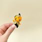 Pocket-sized articulated figure designed for gentle fidgeting and display.
