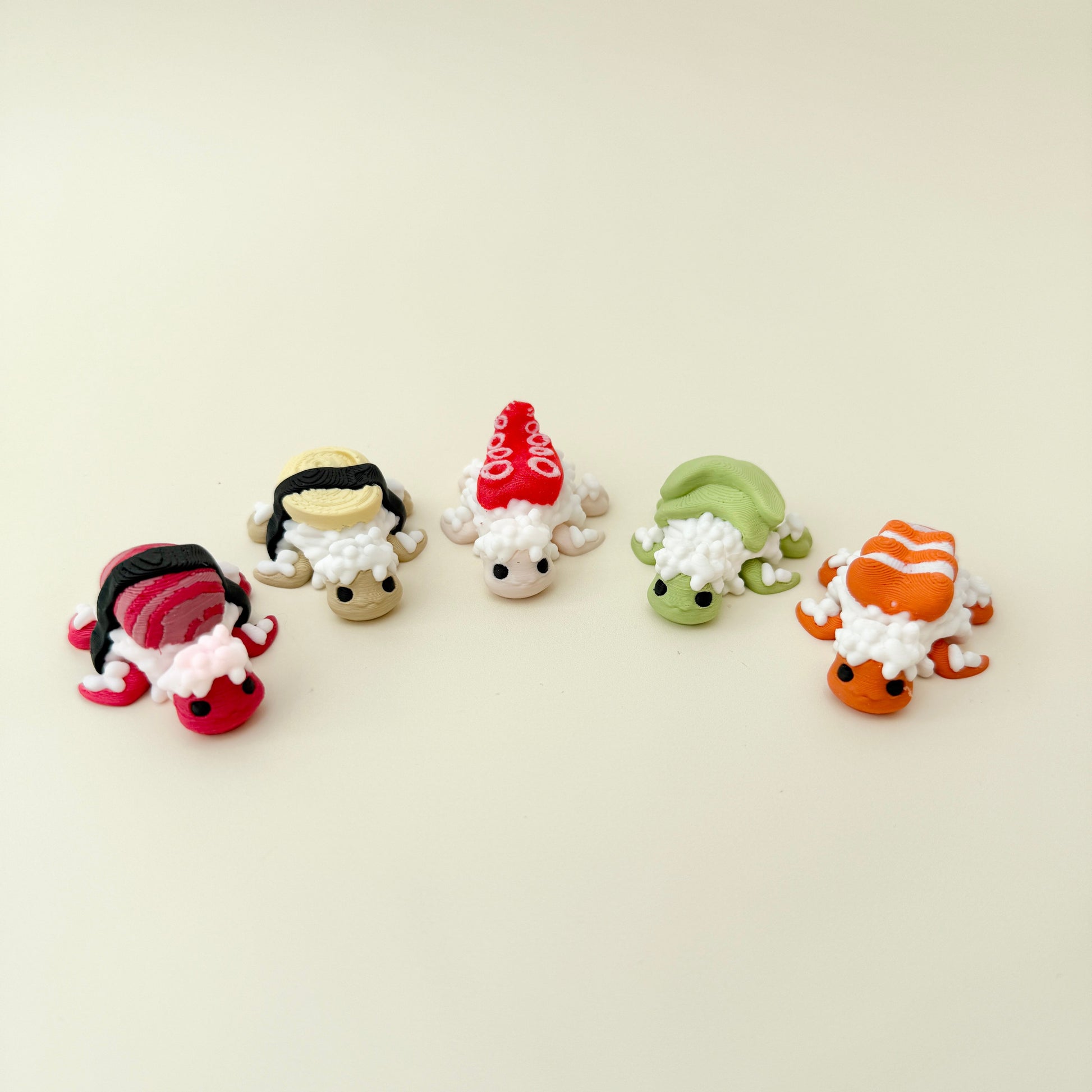 Compact turtles with avocado and shrimp toppings, quiet movement and tactile ridges for discreet fidgeting.