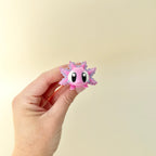 Flexible axolotl toy with glittery finish and cute design