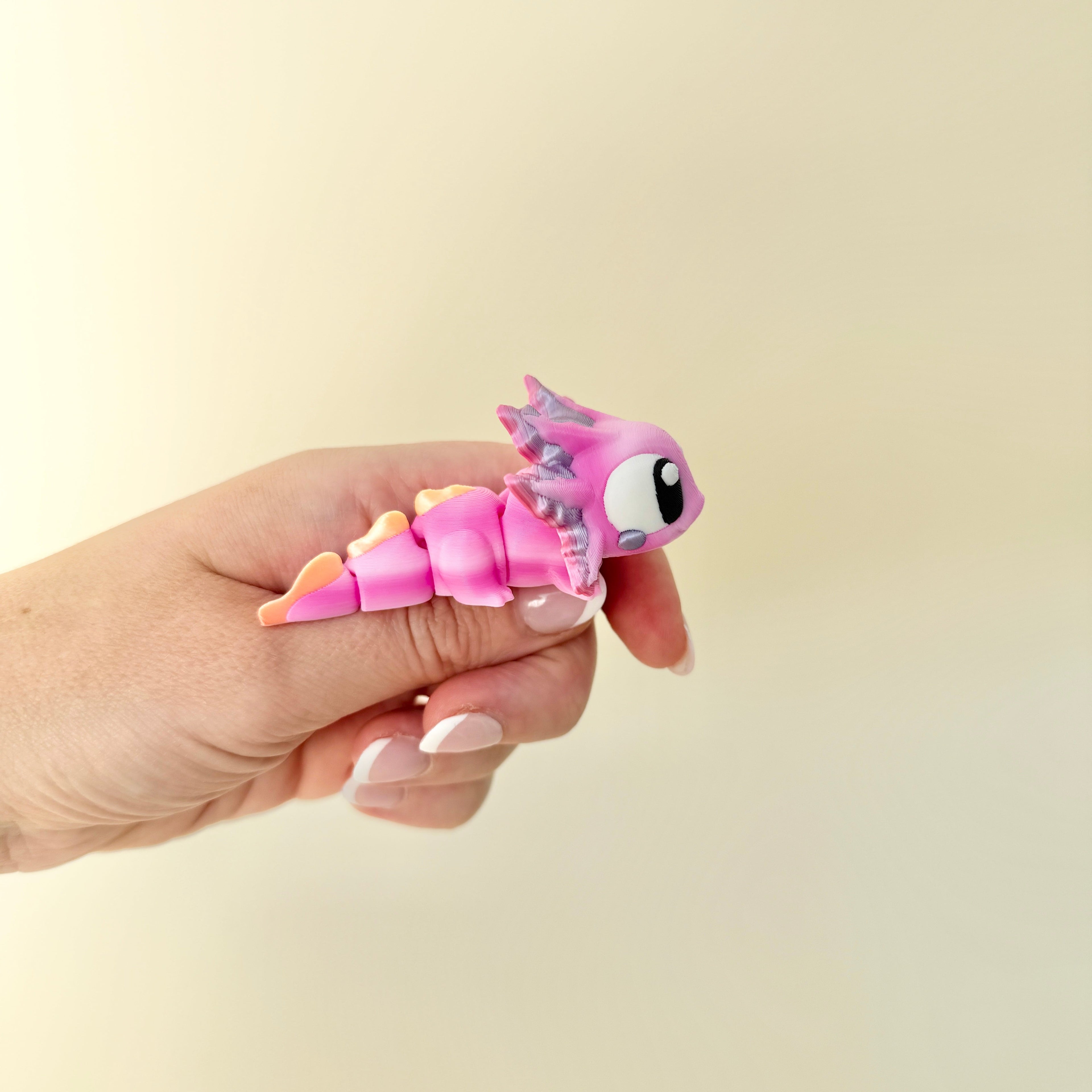 Articulated pink axolotl sensory fidget with shimmer accents