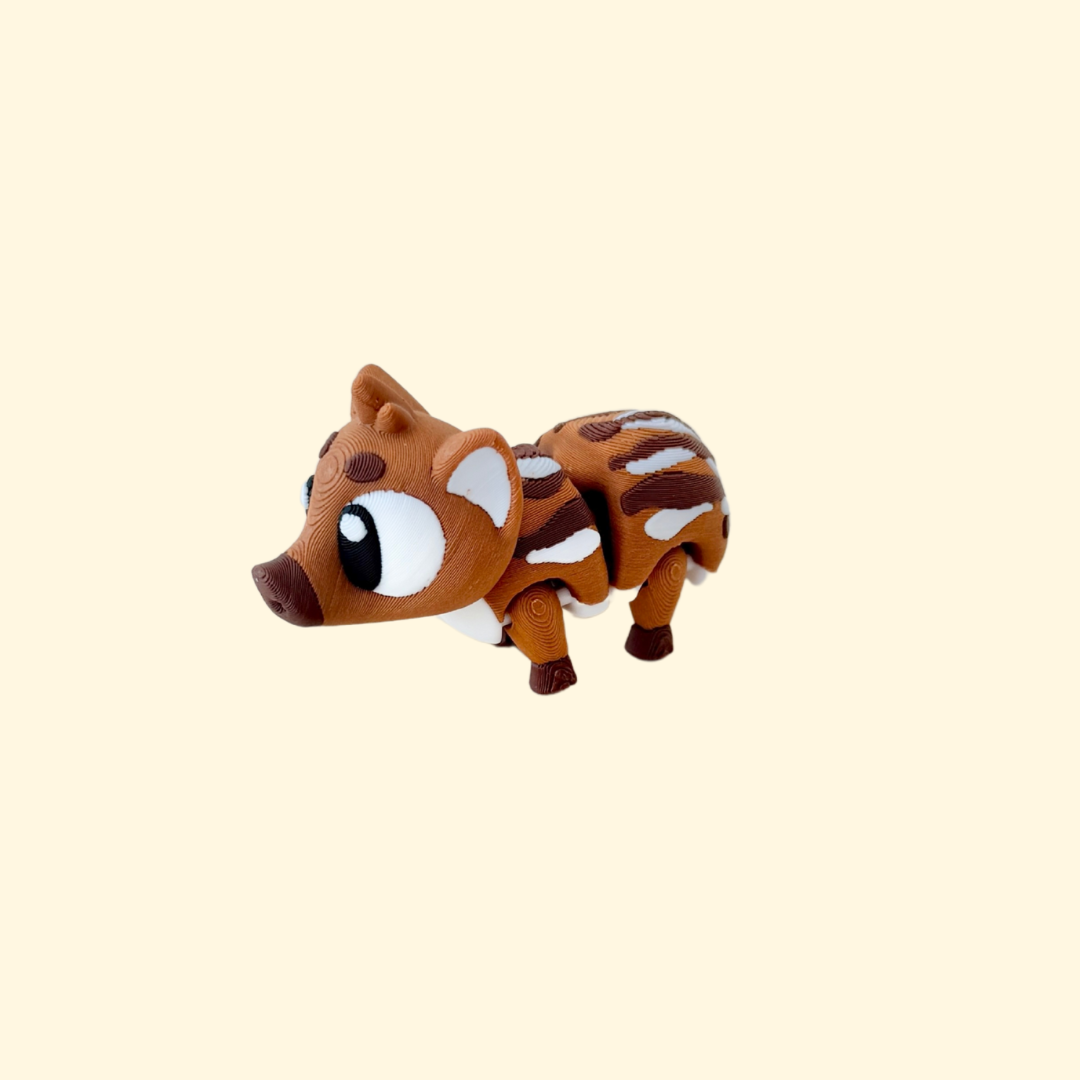A fully articulated baby boar fidget toy featuring two shades of brown with white markings and big eyes.