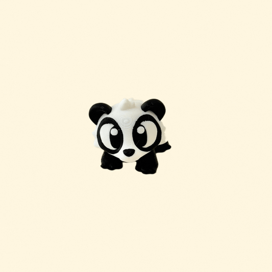 A 6cm black and white baby panda fidget toy with articulated legs, a turning head, and textured fur detail.