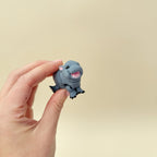 Baby hippo fidget toy with smooth surface for thumb tracing and calming
