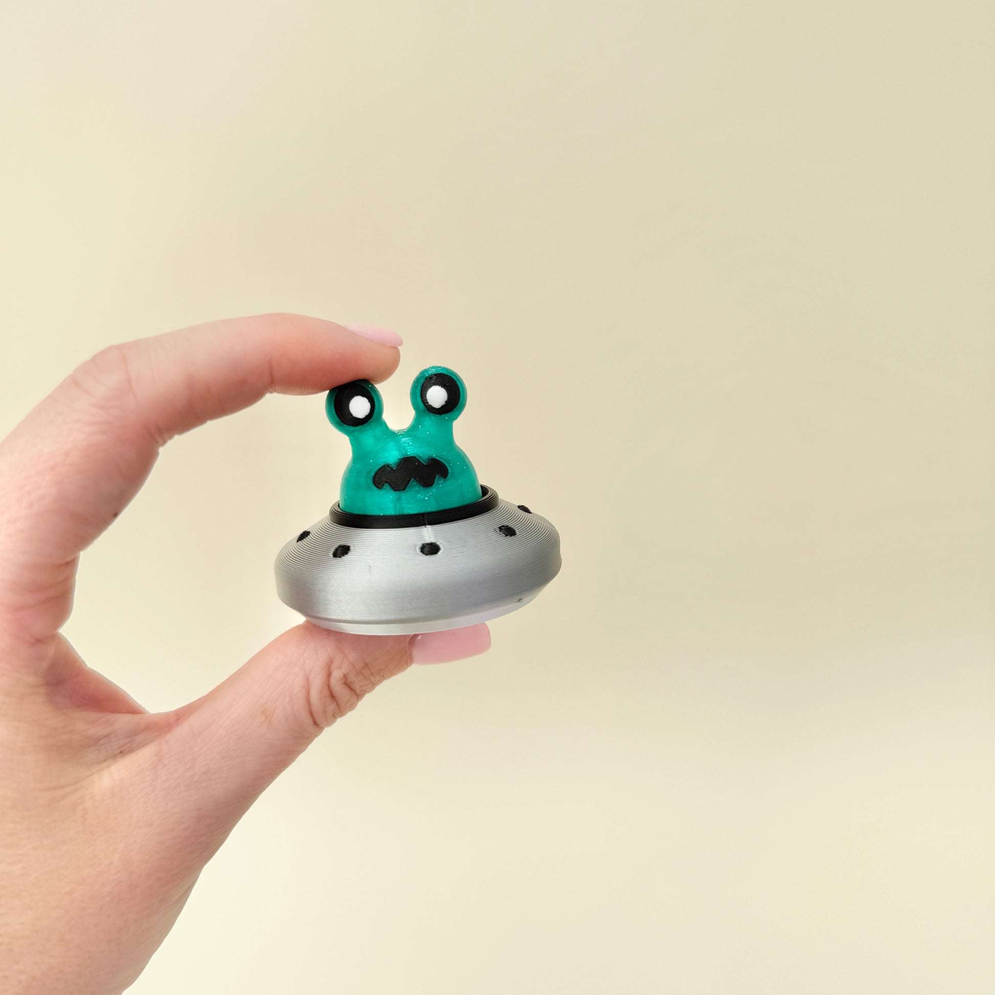 Small spaceship clicker that fits neatly on desks or in pockets.
