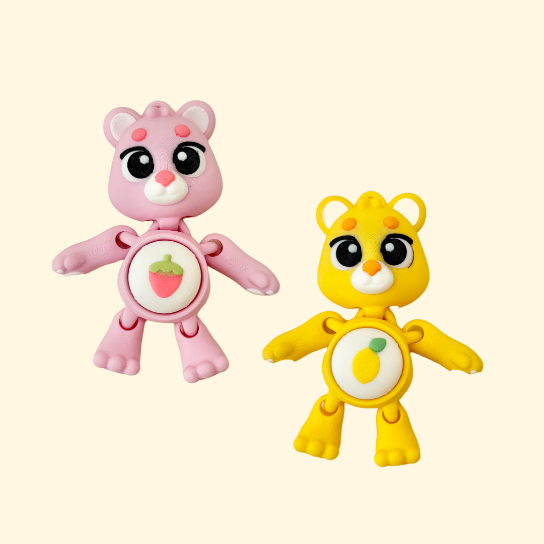 bear-shaped clicker with a pressable belly and keyring loop for easy attachment
