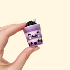 BobaPop sensory clicker toy shaped like a bubble tea drink with textured design and wrist strap.