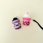 Handheld drink-style stim toy with a pop-in click mechanism and detailed design.