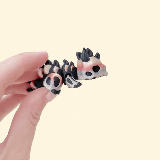 compact skeleton-themed dragon toy designed for quiet stimming and focus
