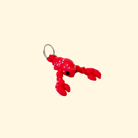 Lanyard attachment with smooth finish and tactile raised dots for tracing and calming hand use.
