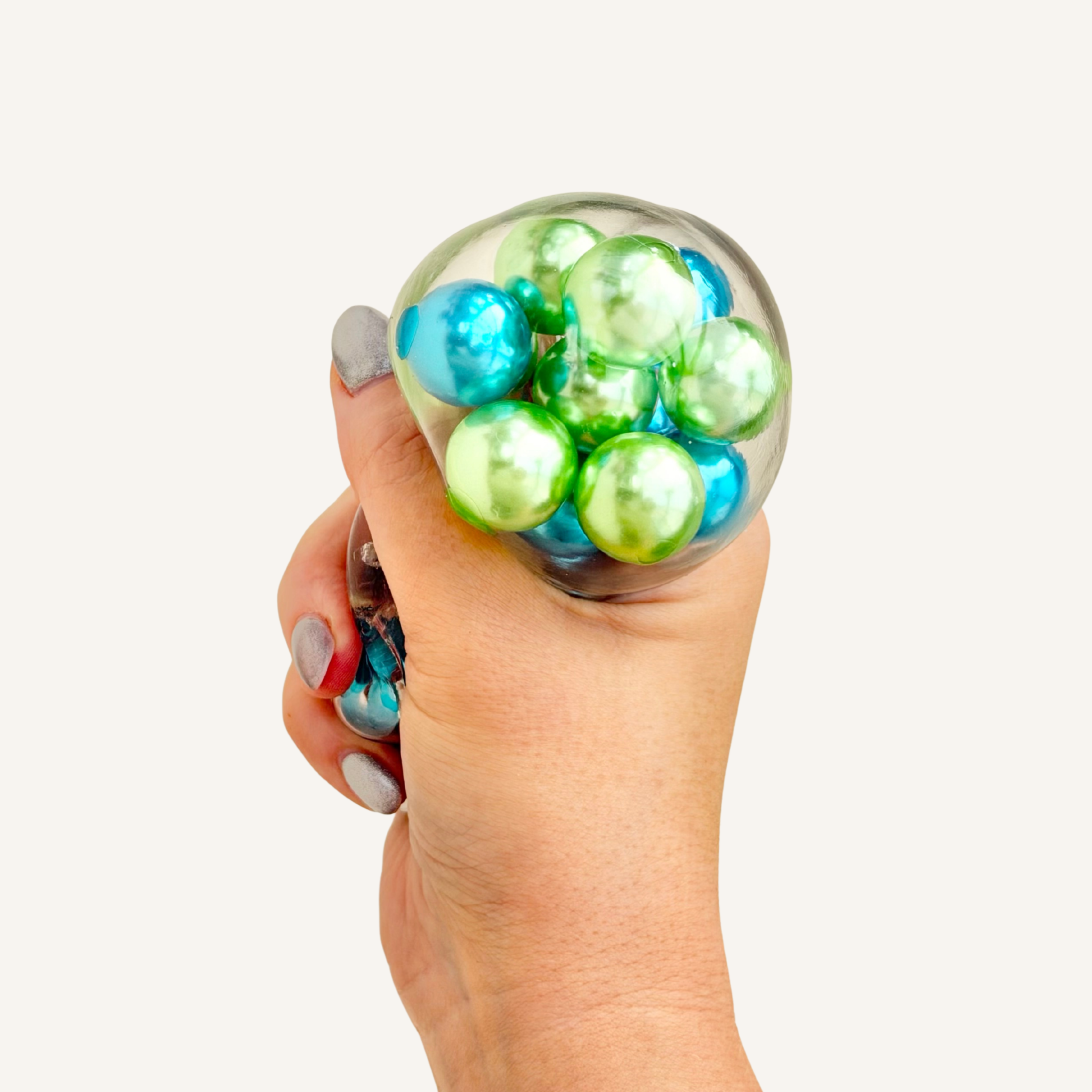 Tactile sensory fidget with bead movement and audible feedback, suited to decompressing, travel and screen break moments.
