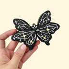 Sensory fidget toy with monochrome butterfly design and raised detailing