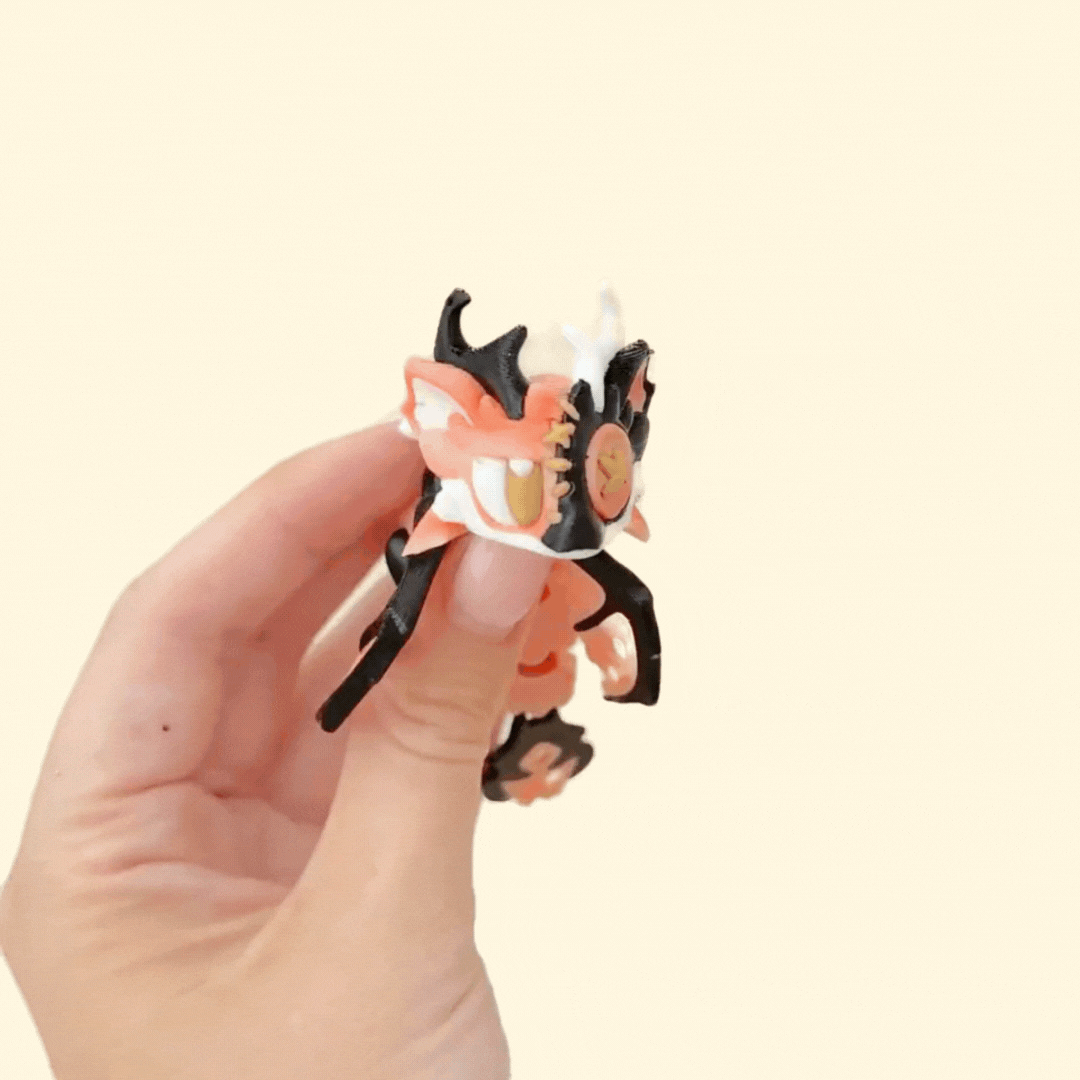 Dragon figure featuring a button eye, exposed bones and thread accents for a spooky look.
