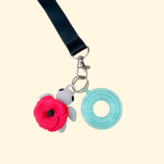 Compact articulated turtle attachment with smooth feel and detailed poppy for quiet, discreet sensory play.
