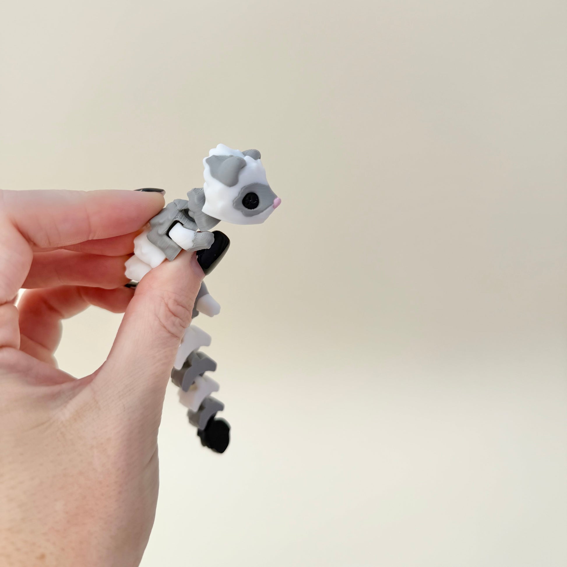 Hand-friendly ferret fidget with flexible spine and tail; soothing motion for gentle stims and regulation.
