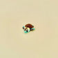 Gradient green and yellow baby turtle fidget with brown textured features.