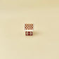 Mini gingerbread house desk toy; roof acts as the button for a satisfying click, tactile icing finish.
