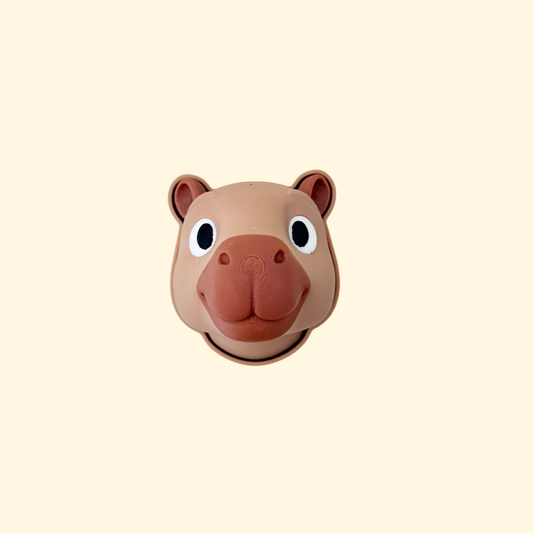 A 3D printed capybara-shaped clicker fidget with a smooth, sculpted finish.
