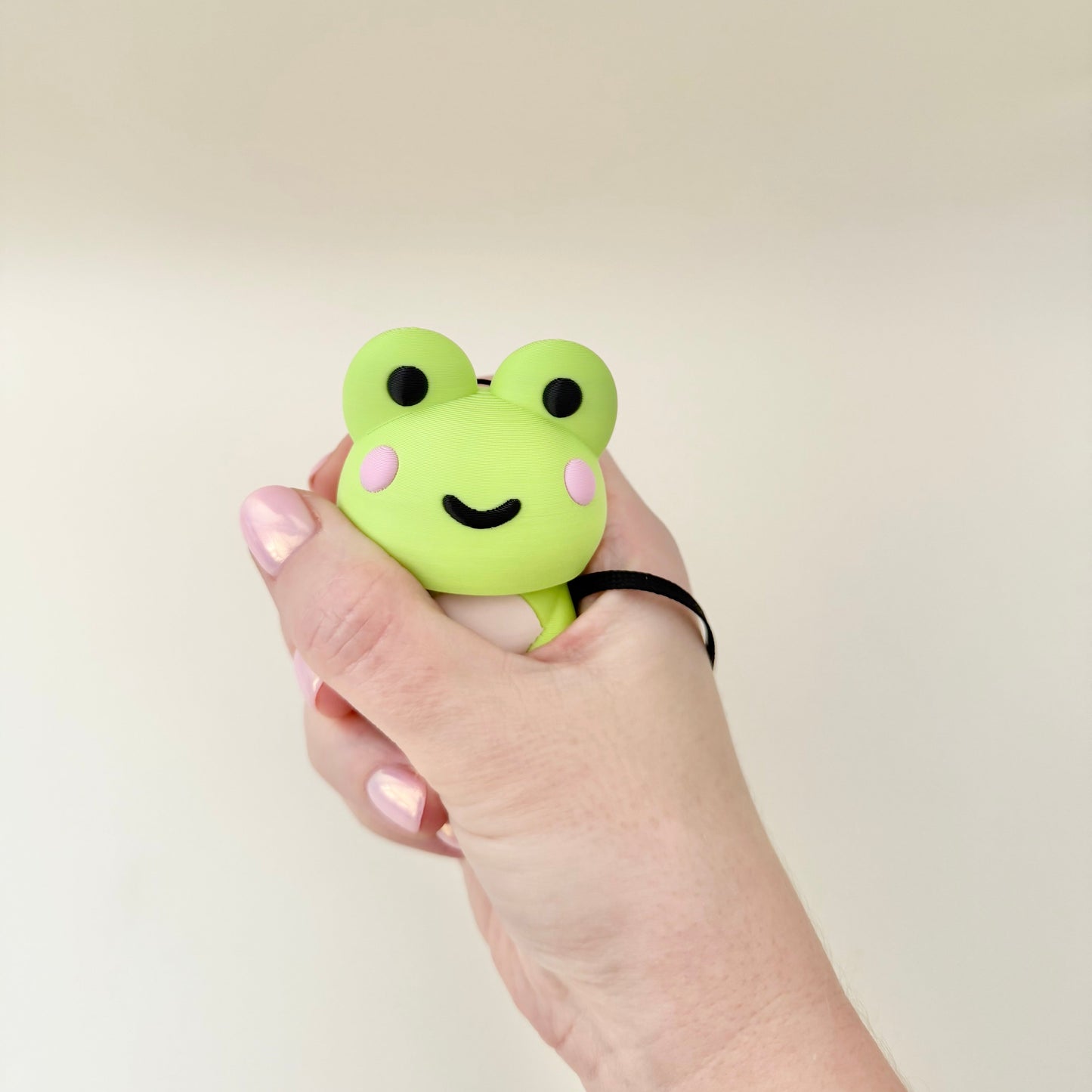 A big tactile clicker fidget made to be worn on the wrist or carried throughout the day
