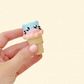 Fun animal-themed fidget toy with click action, textured cone with paw detail
