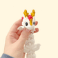 Articulated Lunara dragon fidget toy featuring dreamy stars, moons, and cloud-like wings.
