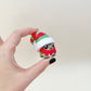 Winter-themed frog clicker for sensory regulation and focus; press-to-click mechanism.
