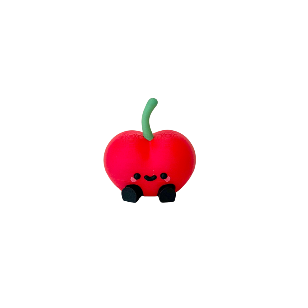 Cute mini fruit character with dangling legs designed for desk, shelf and bedside decor in neuro-friendly spaces
