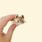 cute palm-sized sensory toy with gentle ridges for thumb tracing
