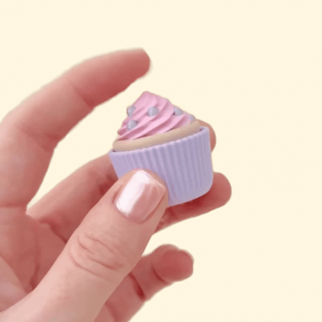 Handheld chocolate cupcake clicker featuring gold sprinkles, ideal for on-the-go fidgeting.
