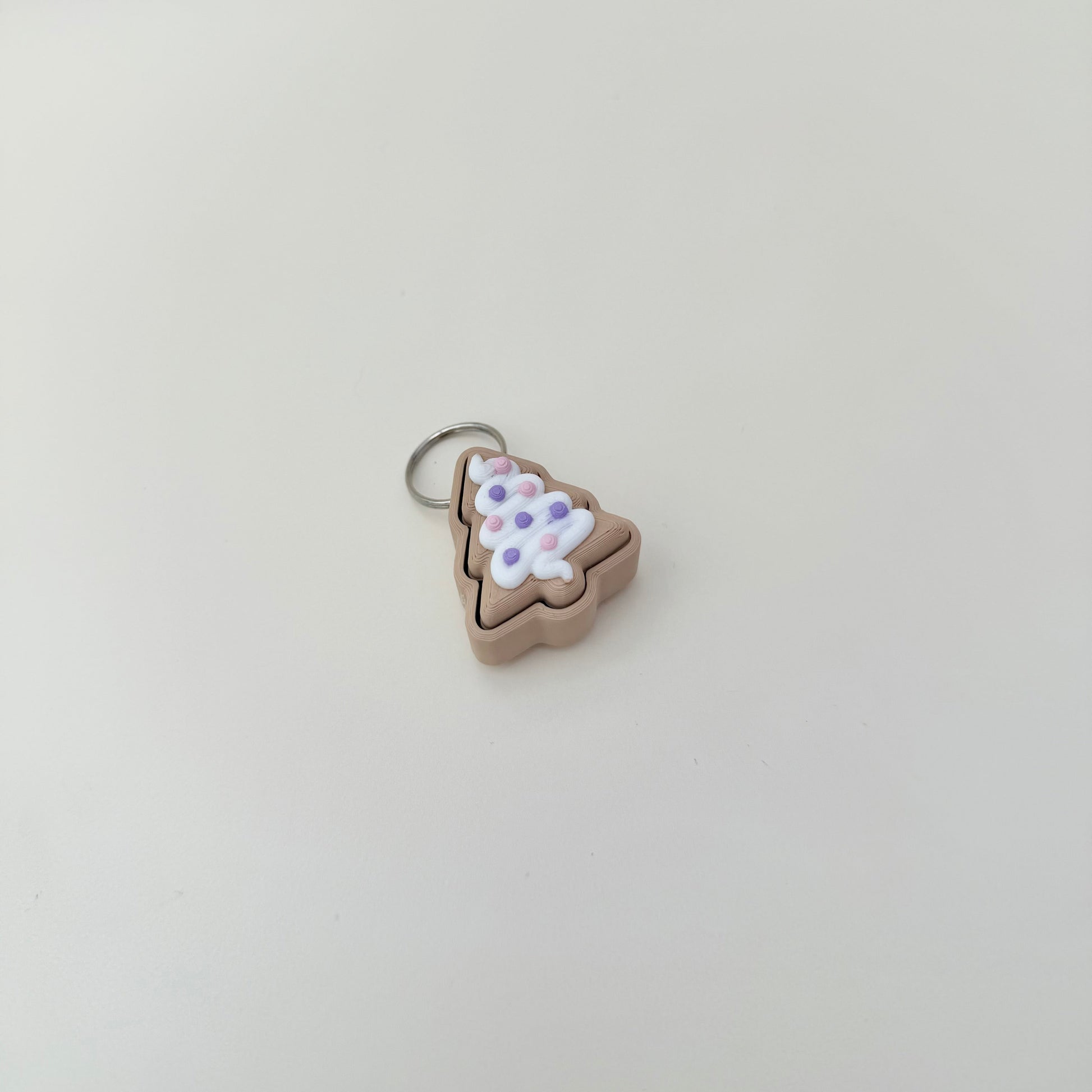 Cute seasonal fidget with tactile finish and compact size; upgrade available to quiet click.
