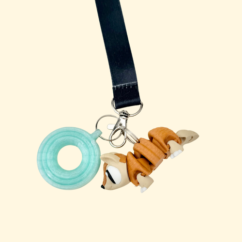 Wearable sensory add-on with medium movement and detailed texture designed for discreet fidgeting on lanyards.
